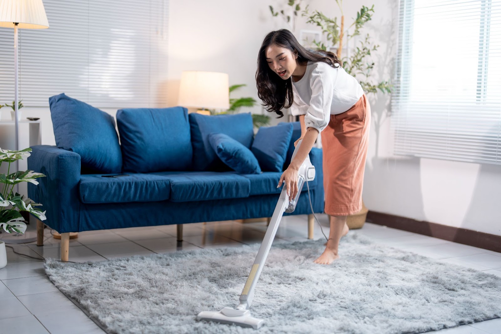 girl vacuuming the floor