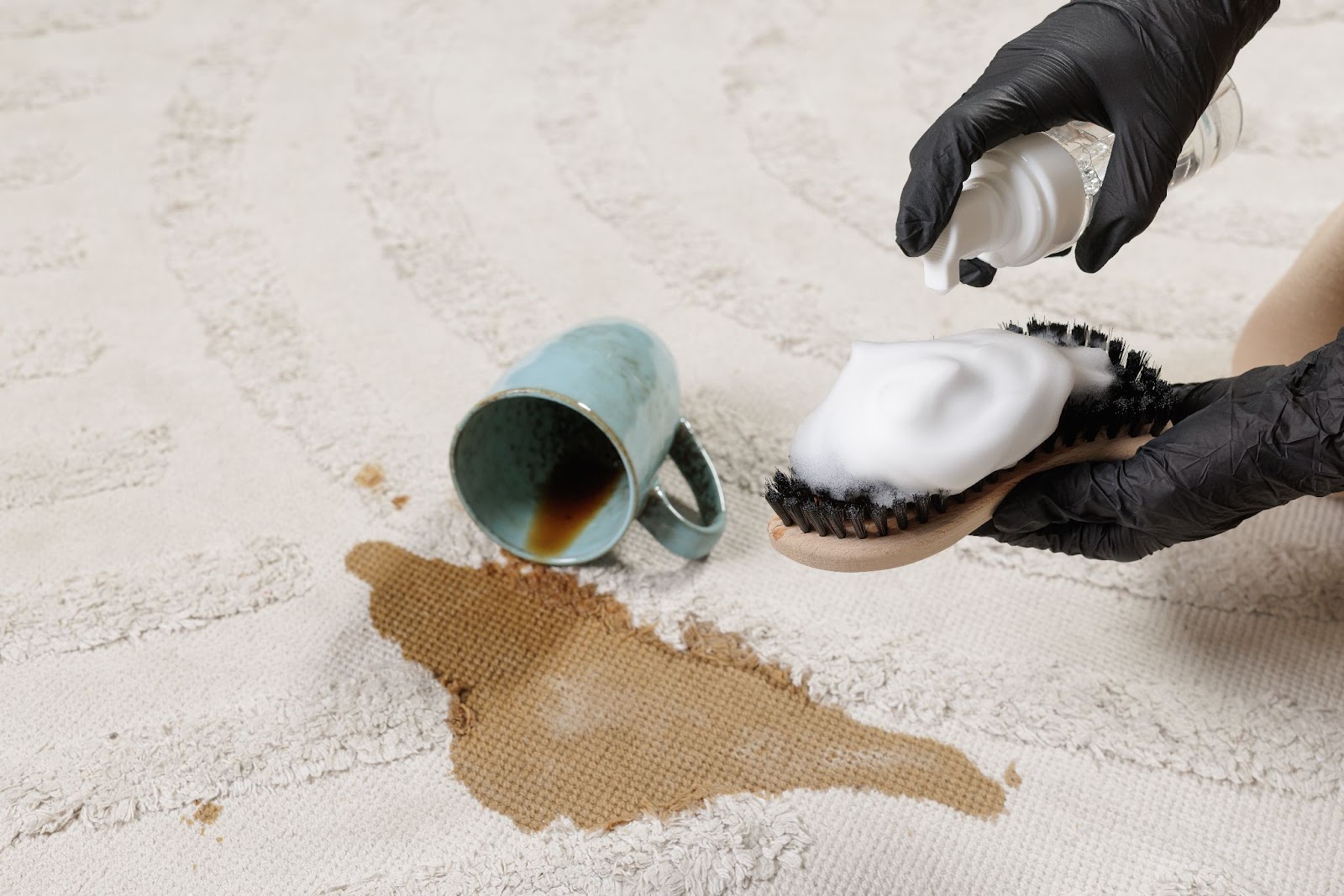 Someone cleaning the spilled drink