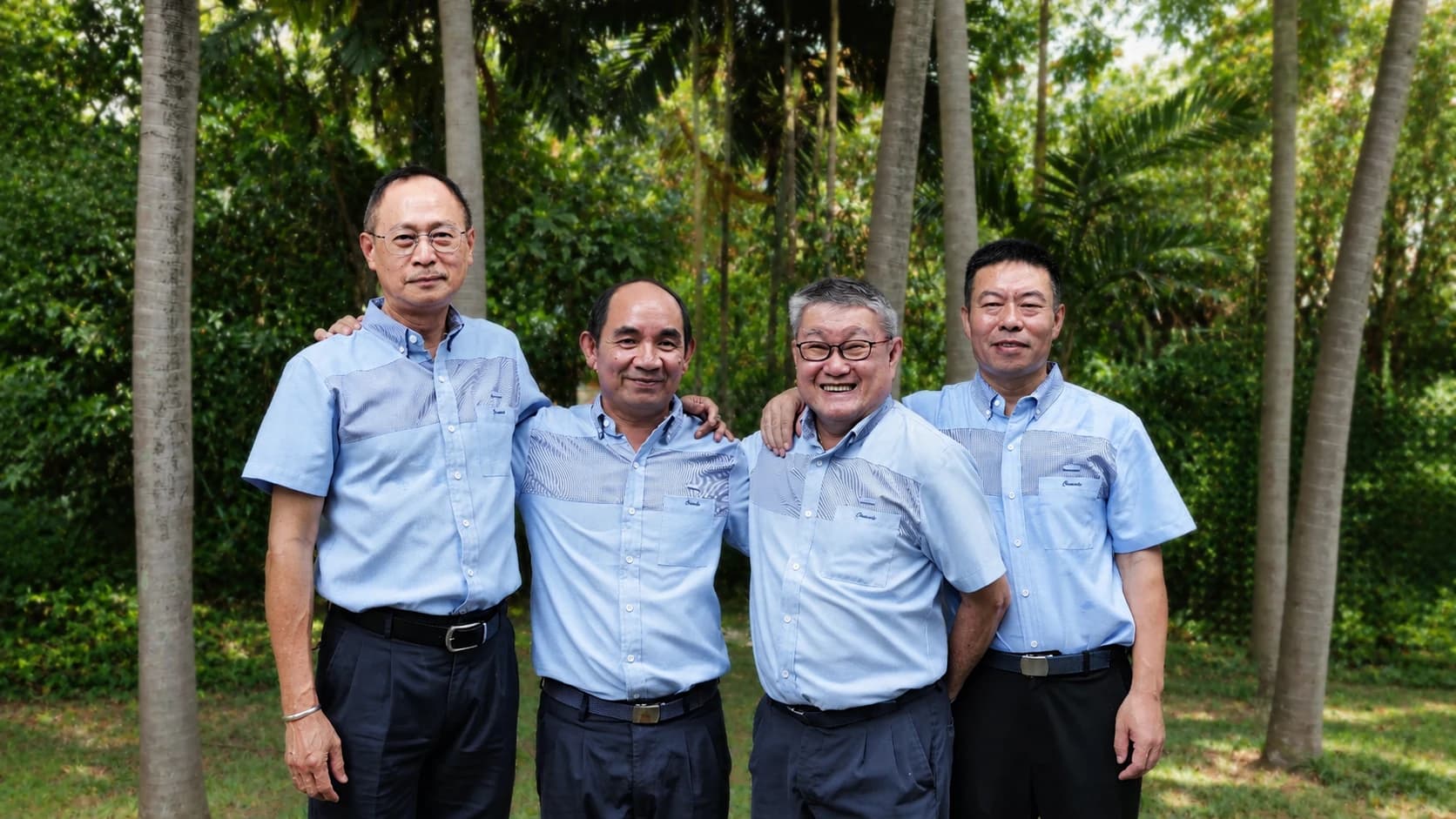 Four long-serving Crusade Services team members outdoors