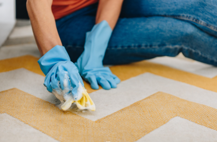 cleaning carpet with scrubbing
